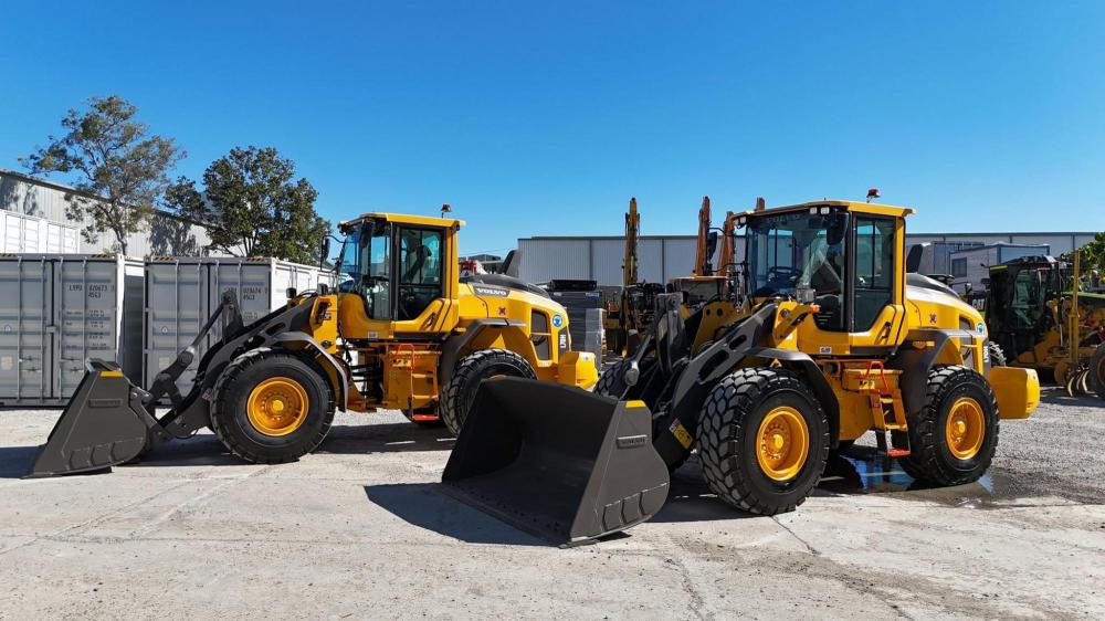 Some yellow machinery with black buckets