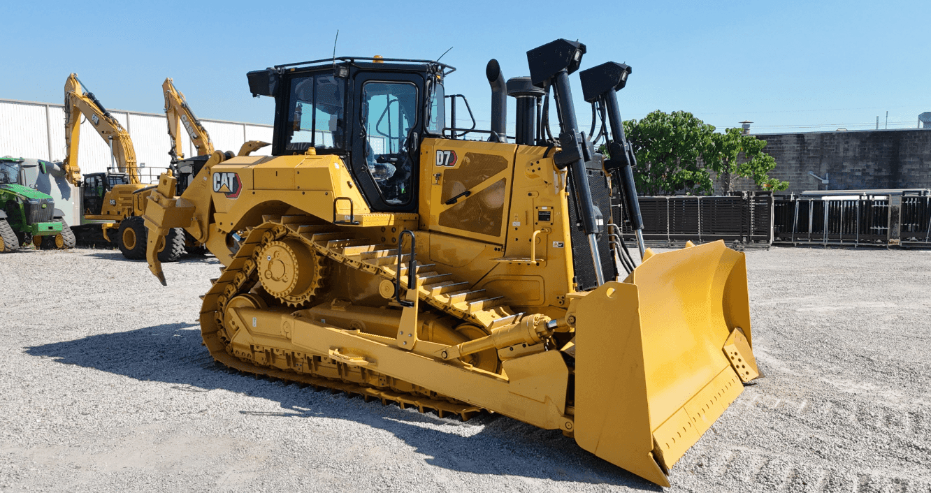 one yellow dozer in a yard